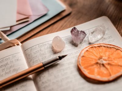 Close up of a wooden desk with meditation tools